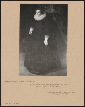 A Lady In A Black Gown With White Ruff Collar