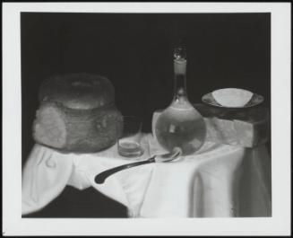 Still Life Of Bread, Butter Amd Cheese With A Knife And A Decanter On A Wine Cloth