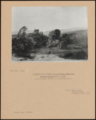 A Castle By A River In A Wooded Landscape Possibly Kilgerran Castle