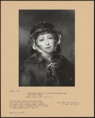 Portrait of a Girl in a Red Cape Tied with a Bow and a Black Bonnet