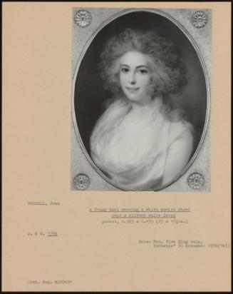 A Young Girl Wearing a White Muslin Shawl Over a Silvery White Dress