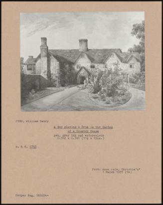 A Boy Playing A Drum In The Garden Of A Country House