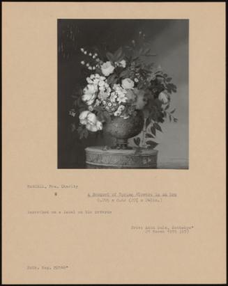 A Bouquet Of Spring Flowers In An Urn