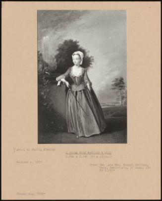 A Young Lady Holding A Whip