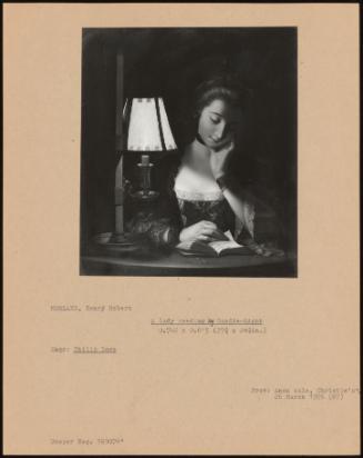 A Lady Reading By Candle-Light