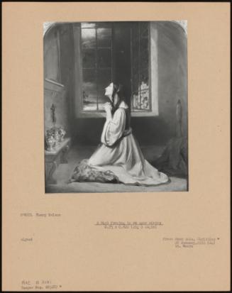 A Girl Praying By An Open Window