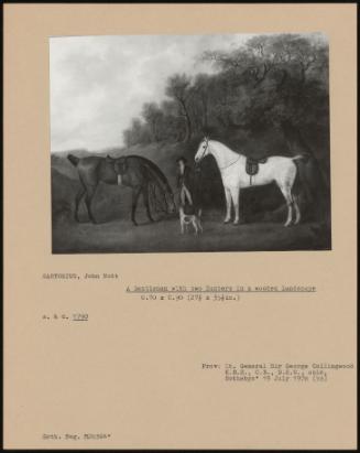 A Gentleman with Two Hunters in a Wooded Landscape