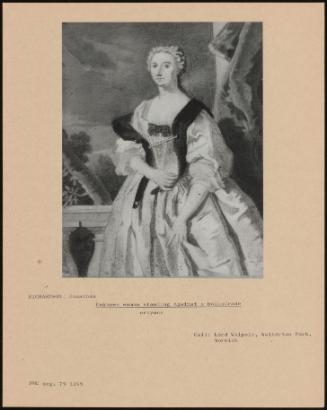 Unknown Woman Standing Against A Balustrade