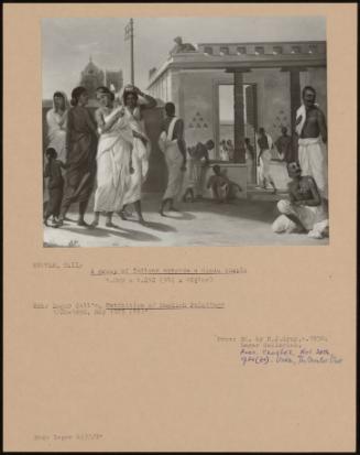 A Group Of Indians Outside A Hindu Temple