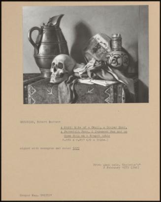 A Still Life Of A Skull, A Cooper Ewer, A Porcelain Vase, A Japanese Fan And An Open Book On A Draped Table