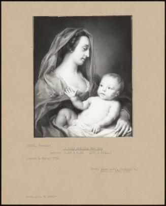 A Lady Holding Her Son