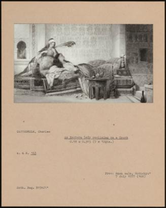 An Eastern Lady Reclining On A Couch