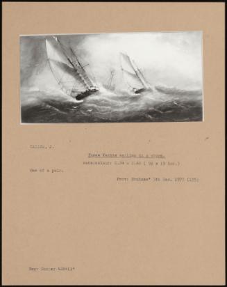Three Yachts Sailing In A Storm