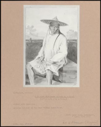 A Chinese Fisherman Seated On A Trunk