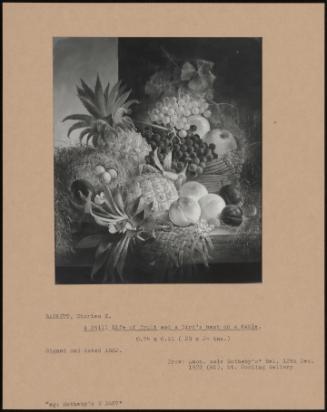 A Still Life Of Fruit And A Bird's Nest On A Table