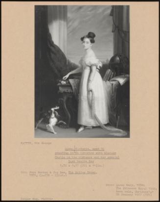 Queen Victoria, Aged 16 Standing In An Interior With Windsor Castle In The Distance And Her Spaniel Dash Beside Her