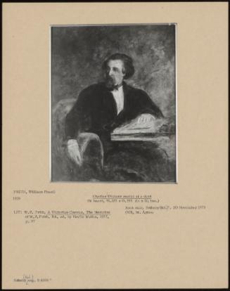 Charles Dickens Seated At A Desk