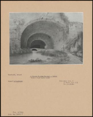 A Stream Passing Through A Tunnel