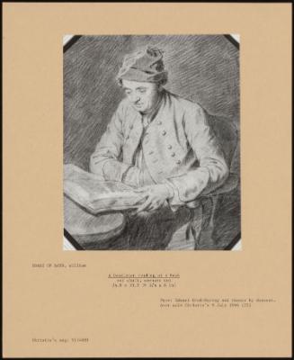 A Gentleman Reading At A Desk