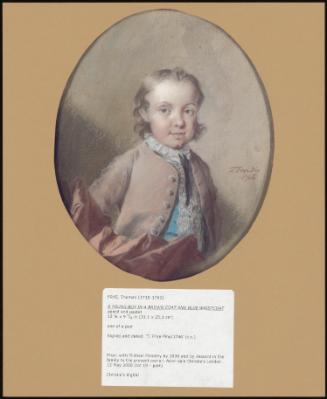 A YOUNG BOY IN A BROWN COAT AND BLUE WAISTCOAT