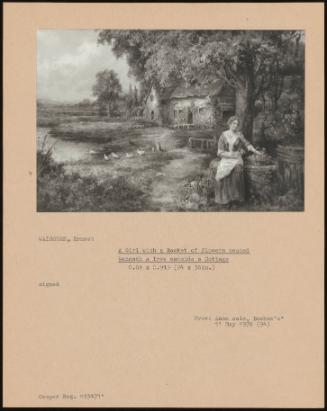 A Girl With A Basket Of Flowers Seated Beneath A Tree Outside A Cottage