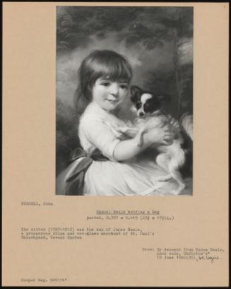 Samuel Neale Holding a Dog