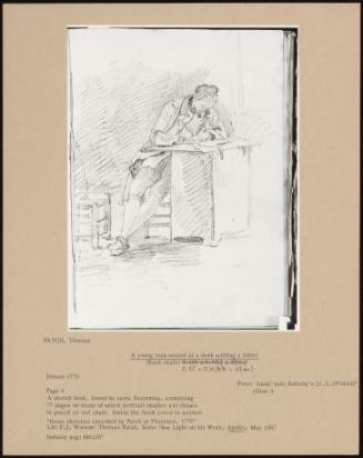 A Young Man Seated At A Desk Writing A Letter