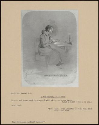 A Man Writing At A Desk.