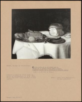 A Still Life of a Chicken and a Lemon on a Bone- Handled Knife on a Plate, on a Draped Table