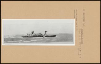 A Tongan (?) Canoe; with a sharp prow and outrigger, manned by two men with paddles