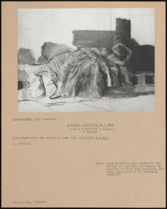 A Woman Reclining On A Bed