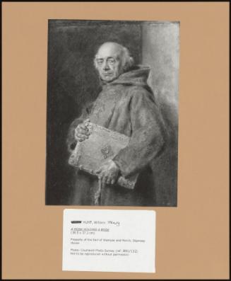 A Monk Holding A Book